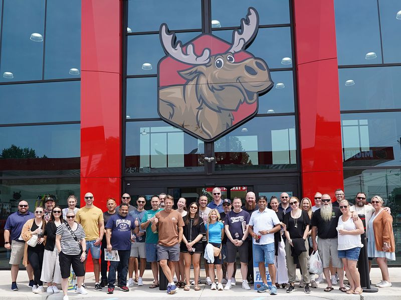 A study tour group outside a U.S. convenience store